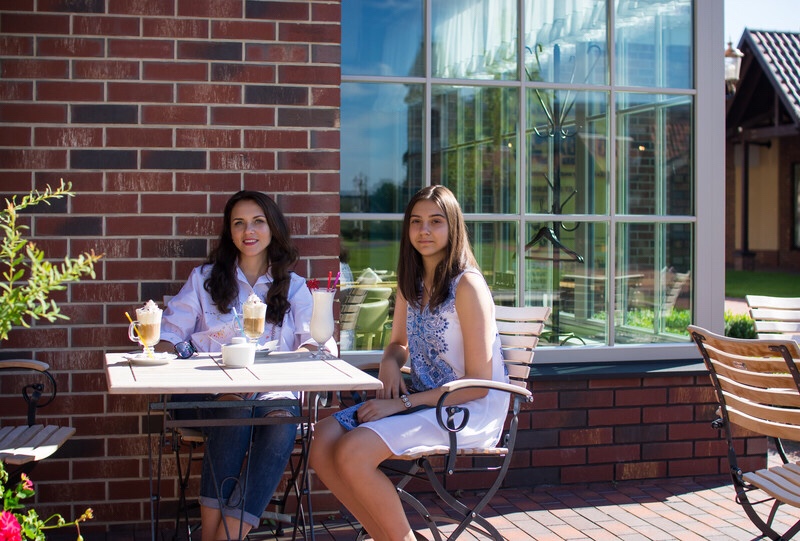 Mother and daughter at cafe.