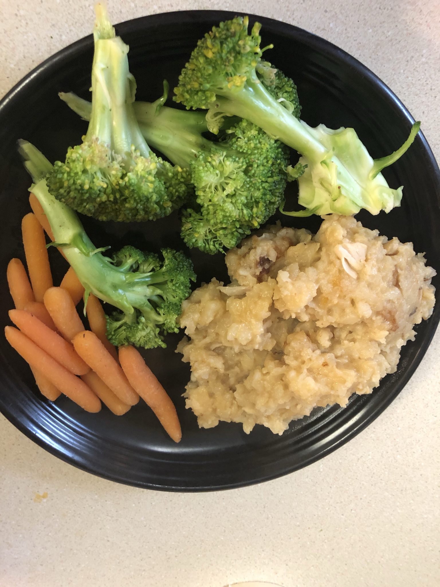 The casserole, broccoli and carrots on a plate.