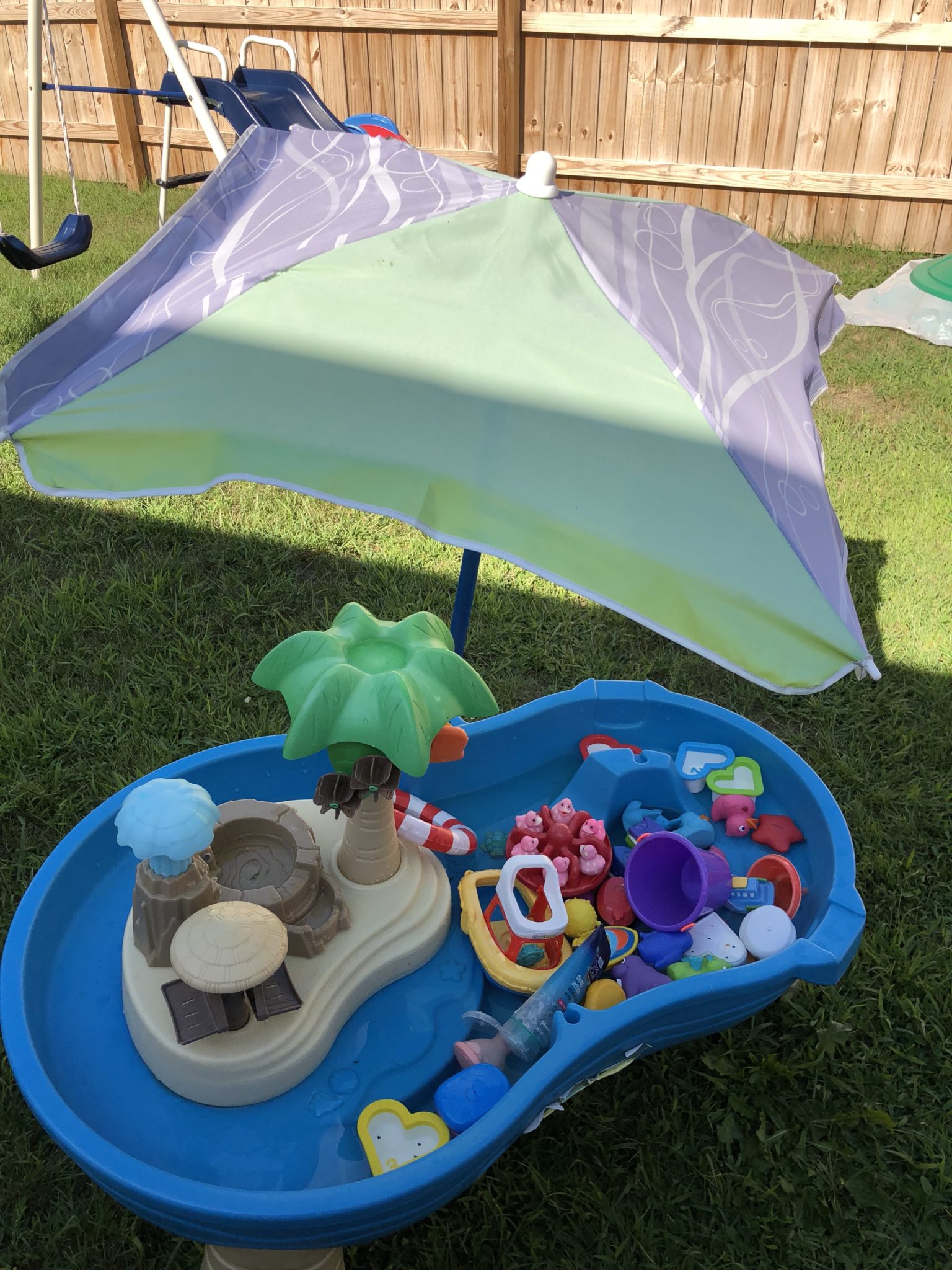 Umbrella over water table.