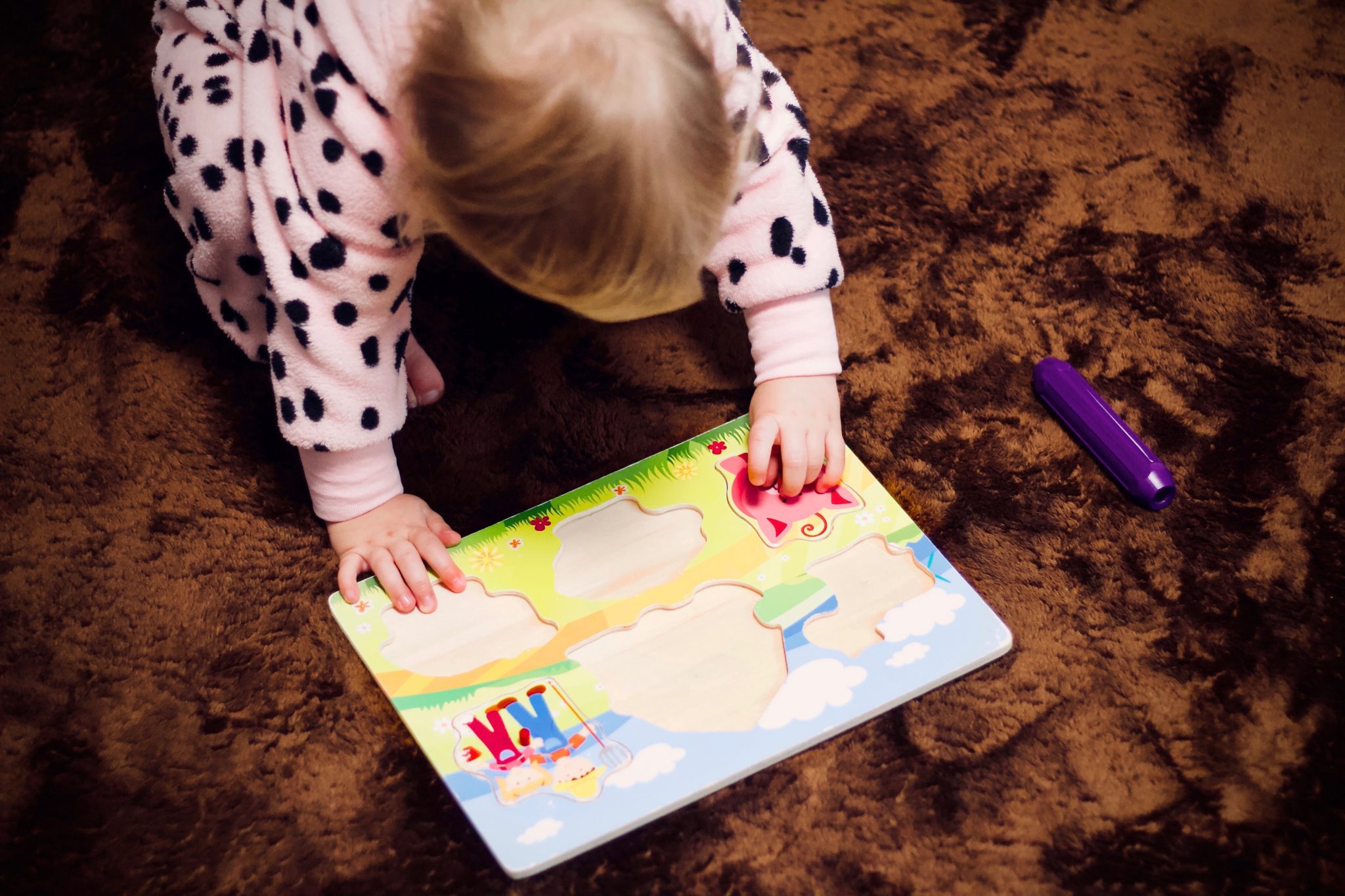 Child solving a puzzle.