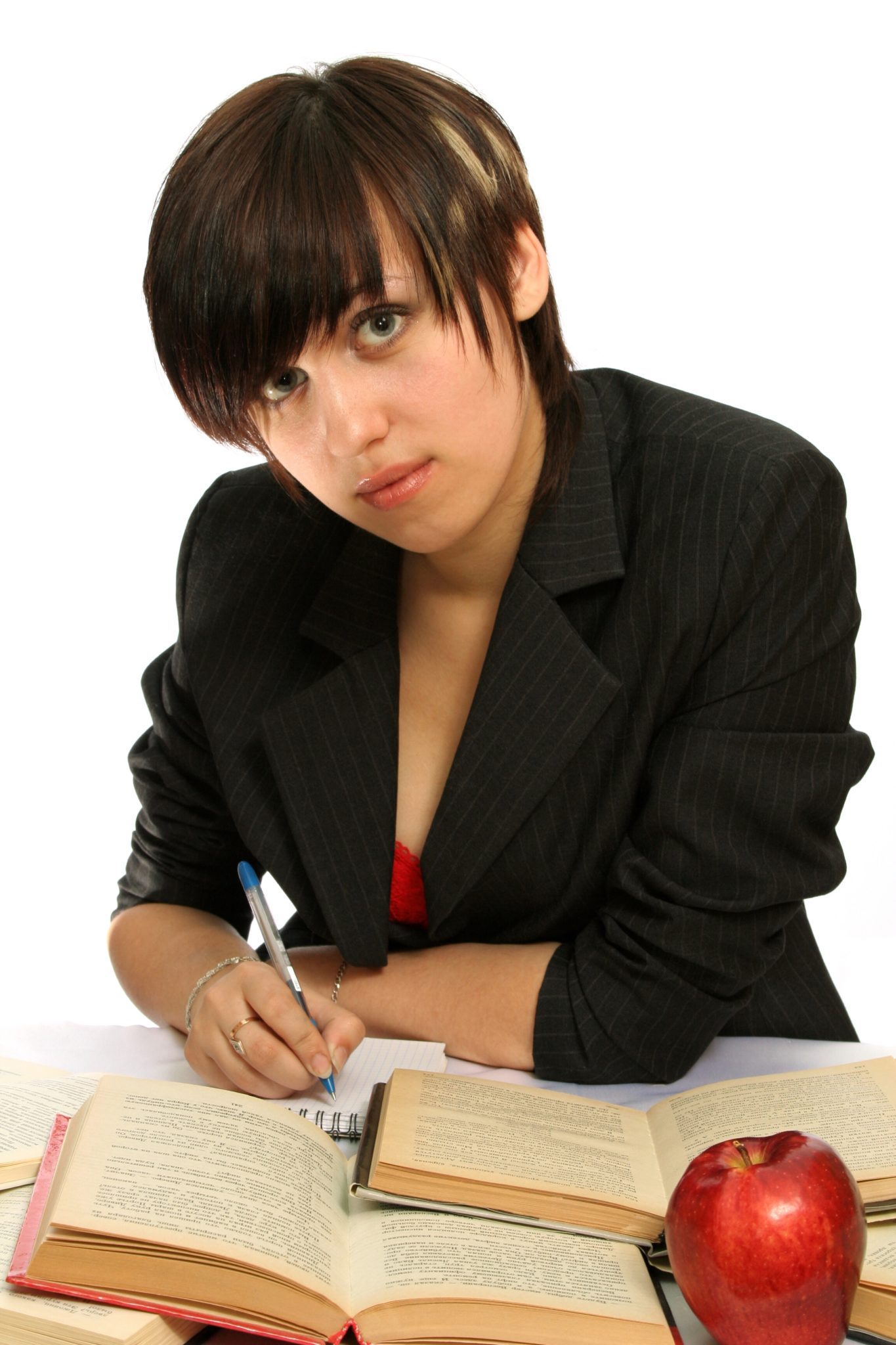 Girl with books and red apple.