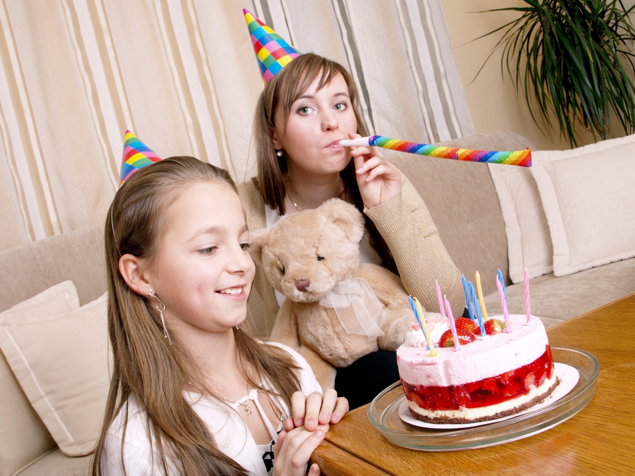 Mother and daughter with birthday cake.