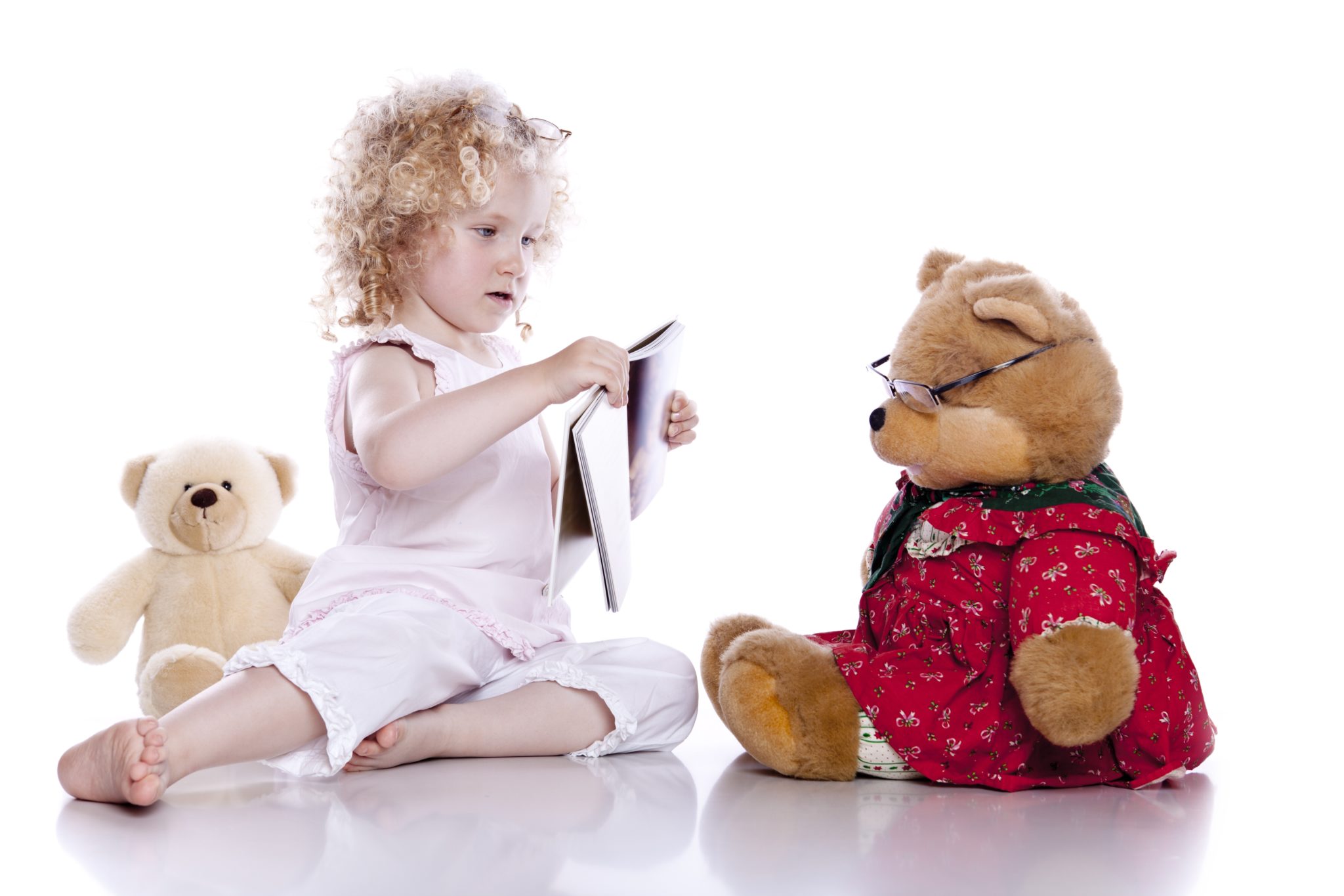 Girl with her teddy bear.