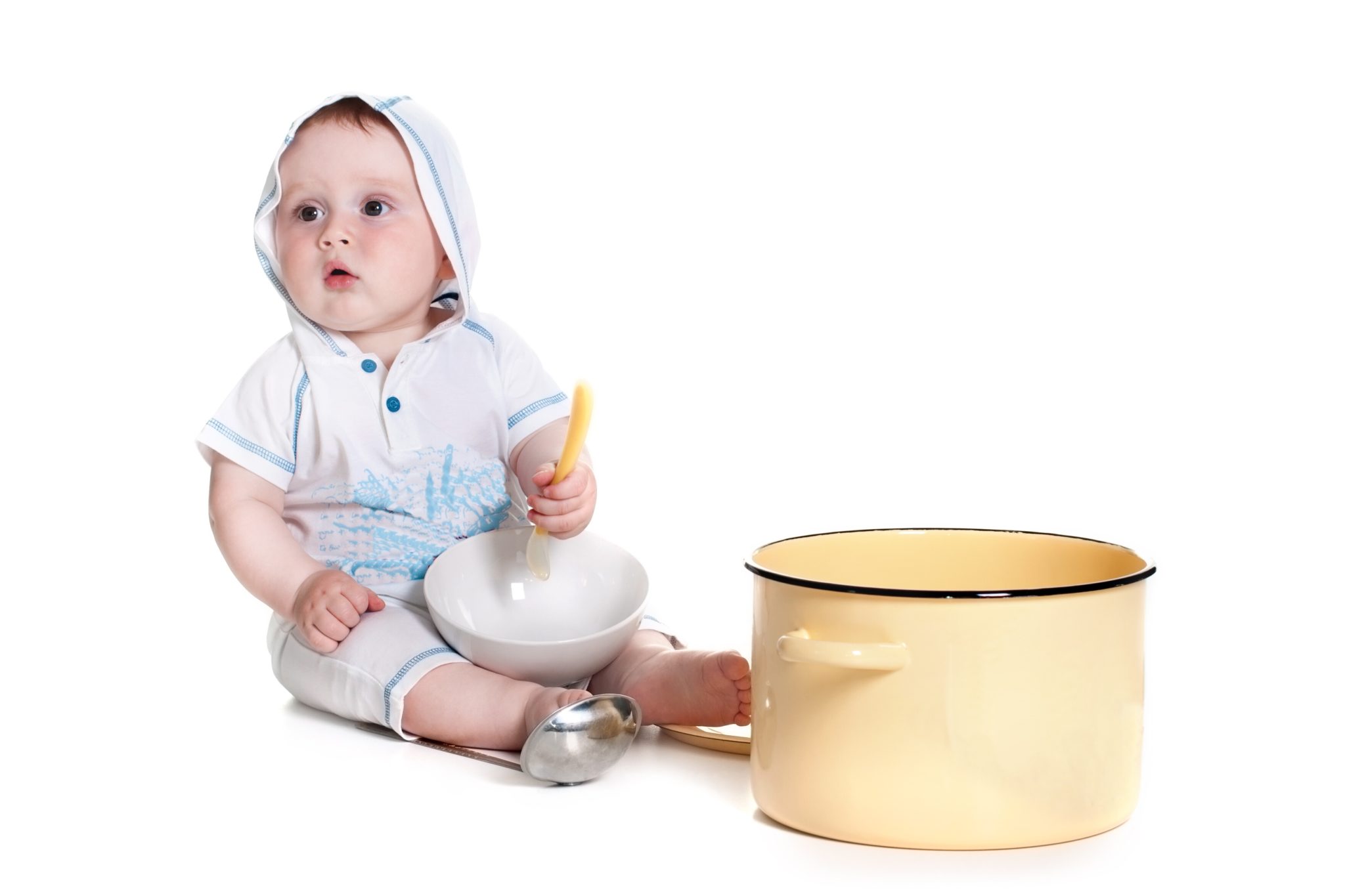 Boy playing with bowls.