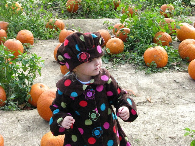 Girl in pumpkin patch.