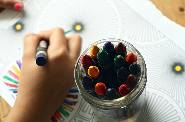 Child’s hand drawing with crayons