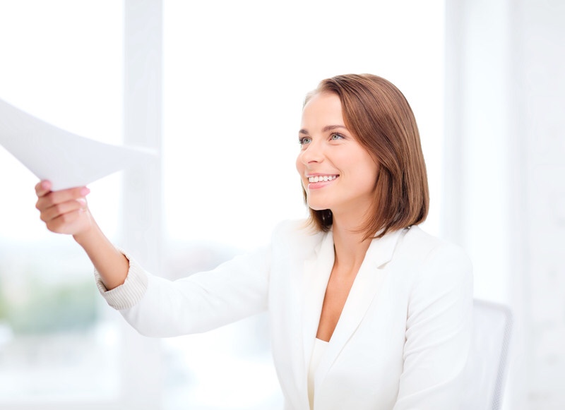 Business woman giving papers