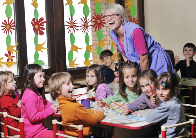 Children and teacher in preschool classroom