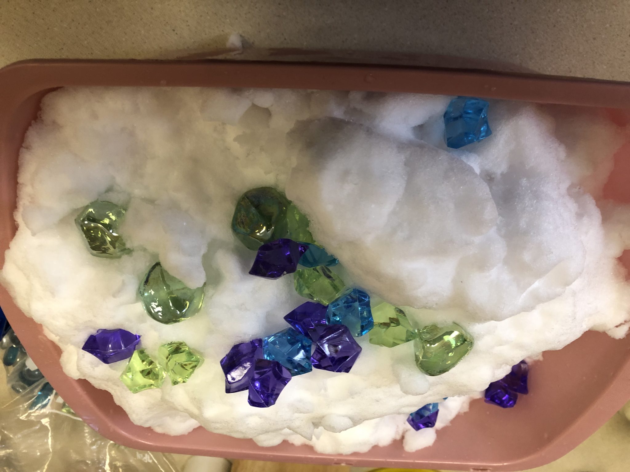 Snow sensory tub with stones