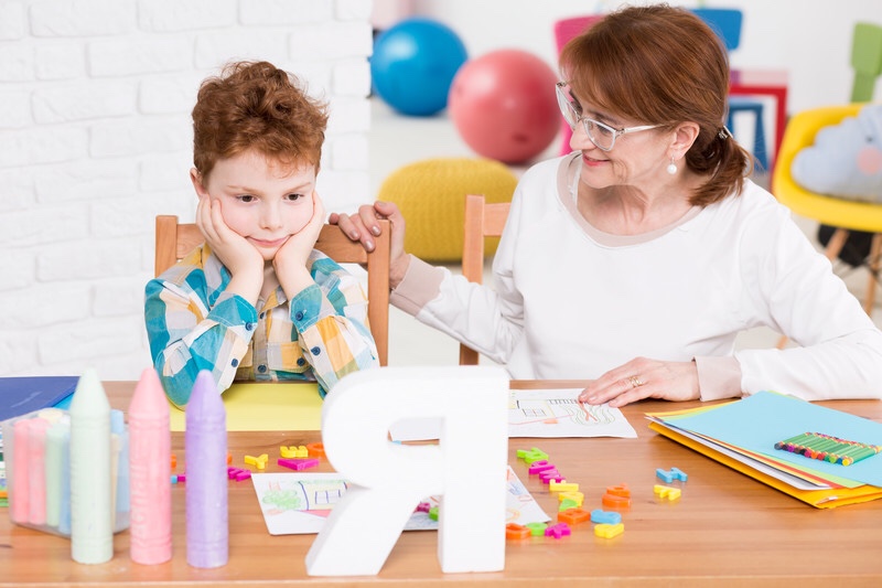 Boy and his speech therapist