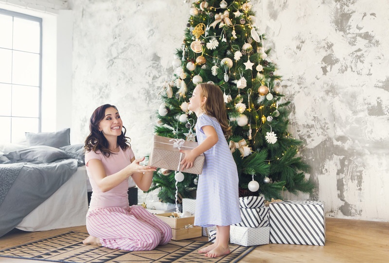 Mother and daughter exchanging gifts