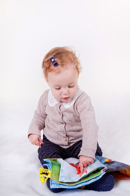 Little girl reading book