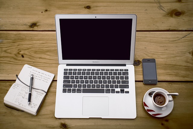 Laptop and coffee on a desk