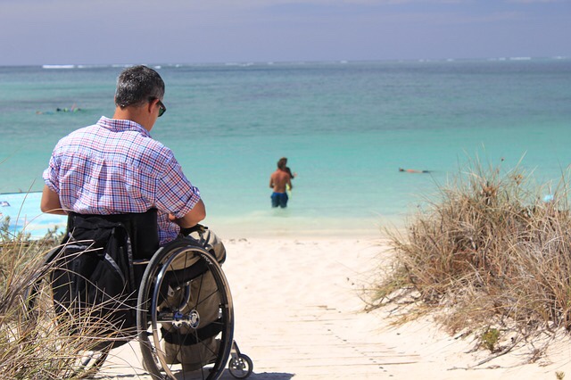 Person in a wheelchair on the beach