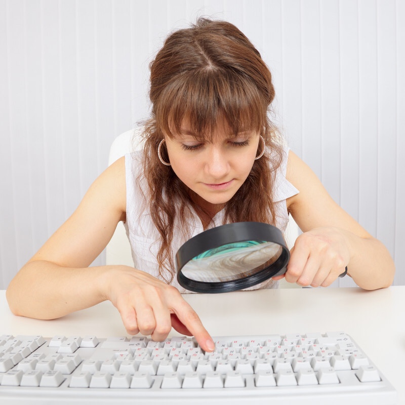 Visually impaired girl uses magnifier