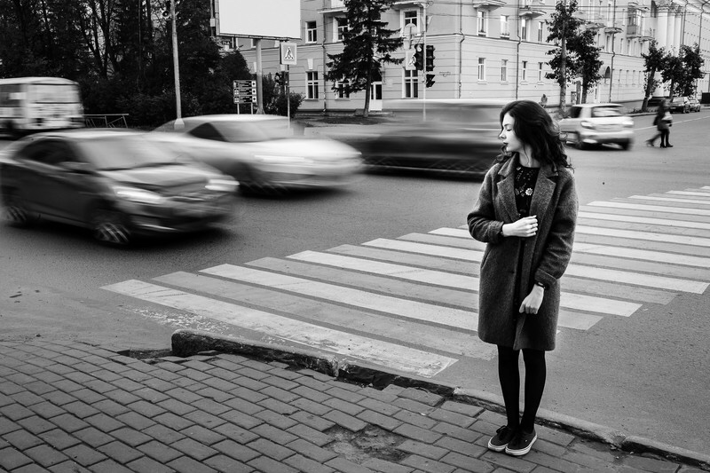 Girl waiting to cross the street