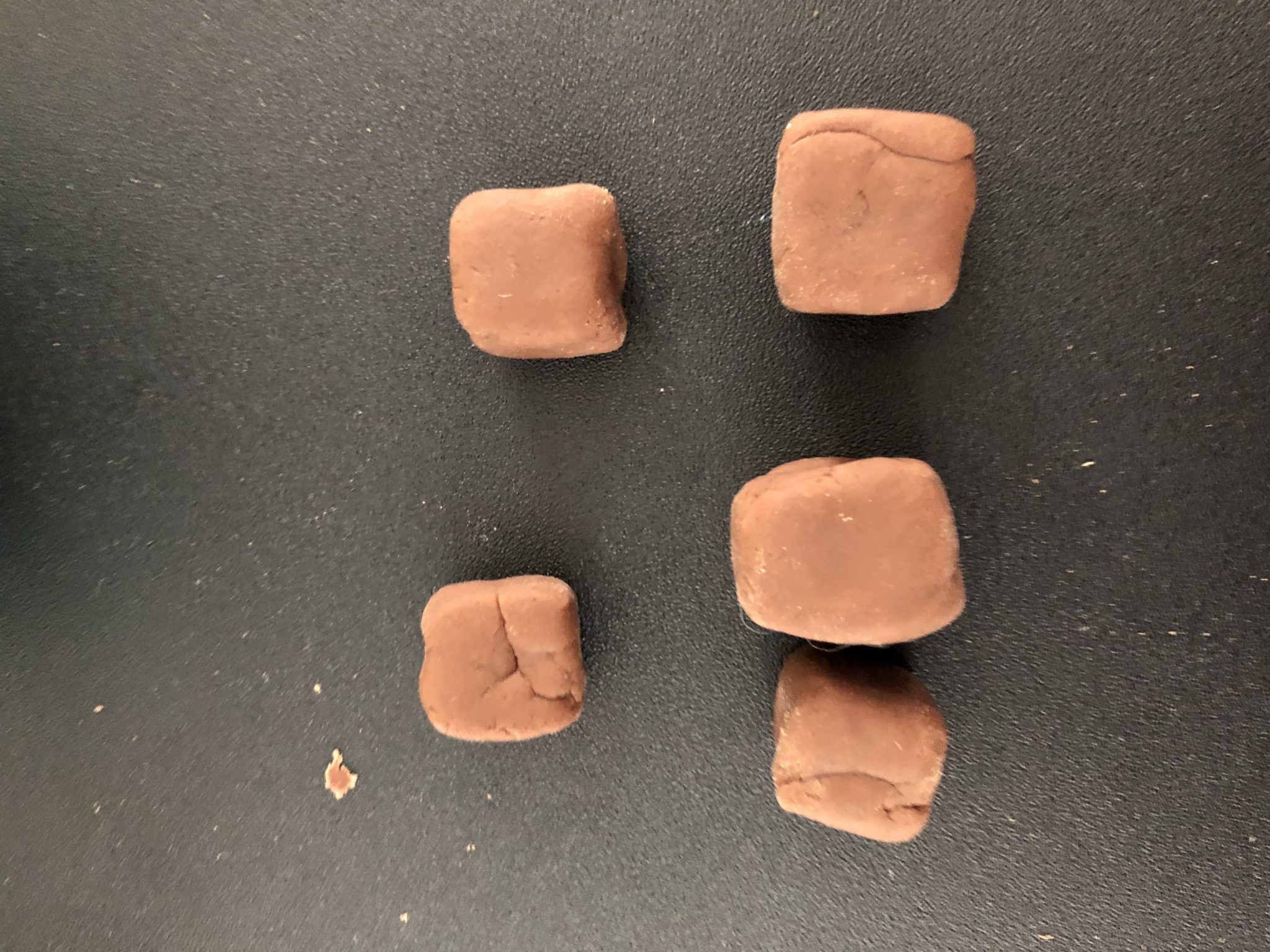 Five play-dough cubes