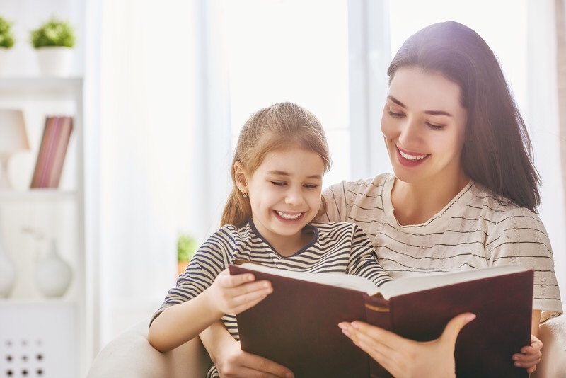 Mother reading to toddler