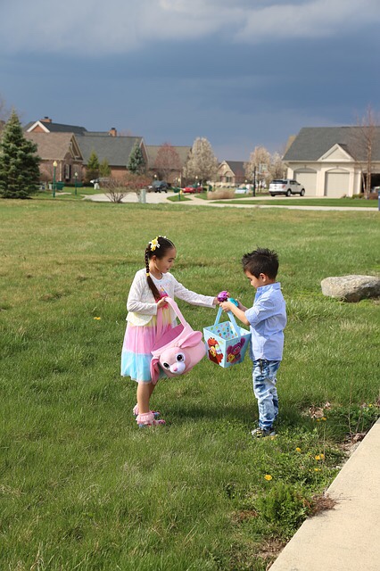 Boy reaching for Easter eggs