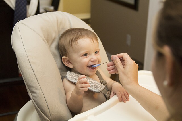 Baby eating first food