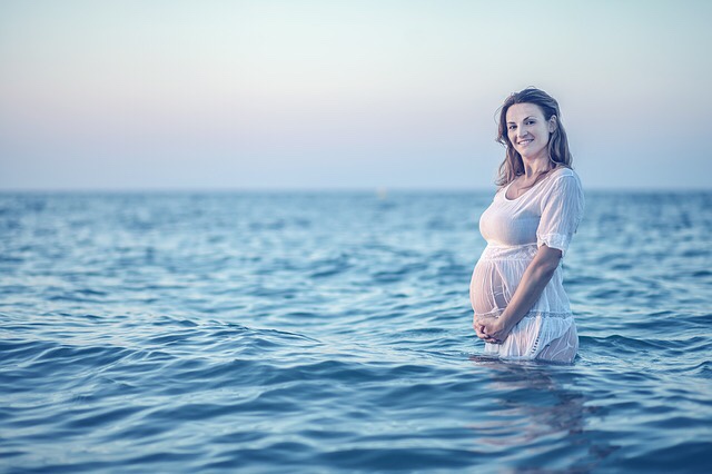 Pregnant woman on the beach