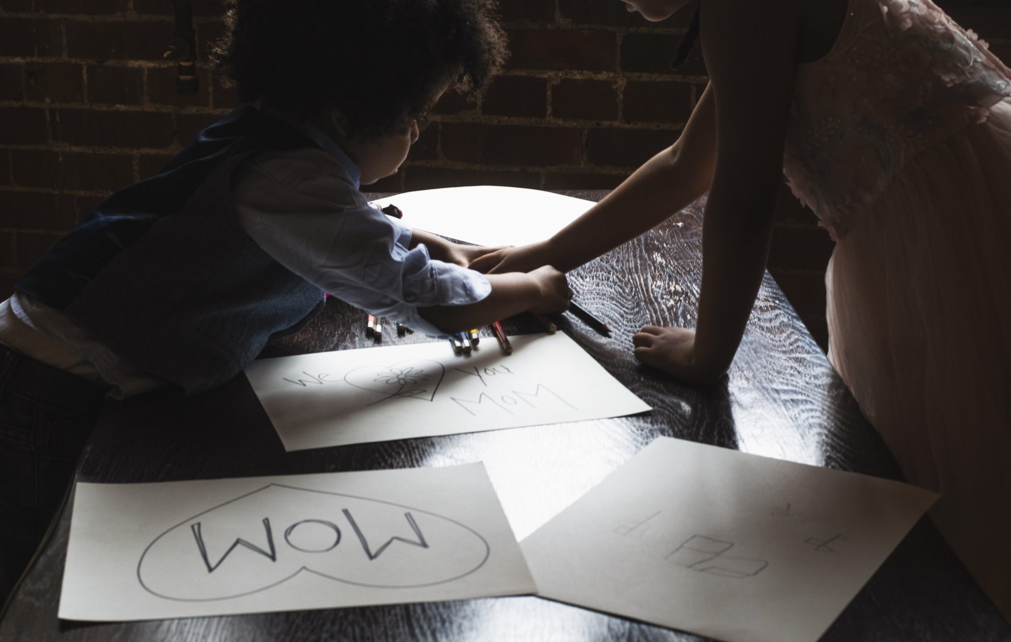 Kids do art work for mom on mothers day