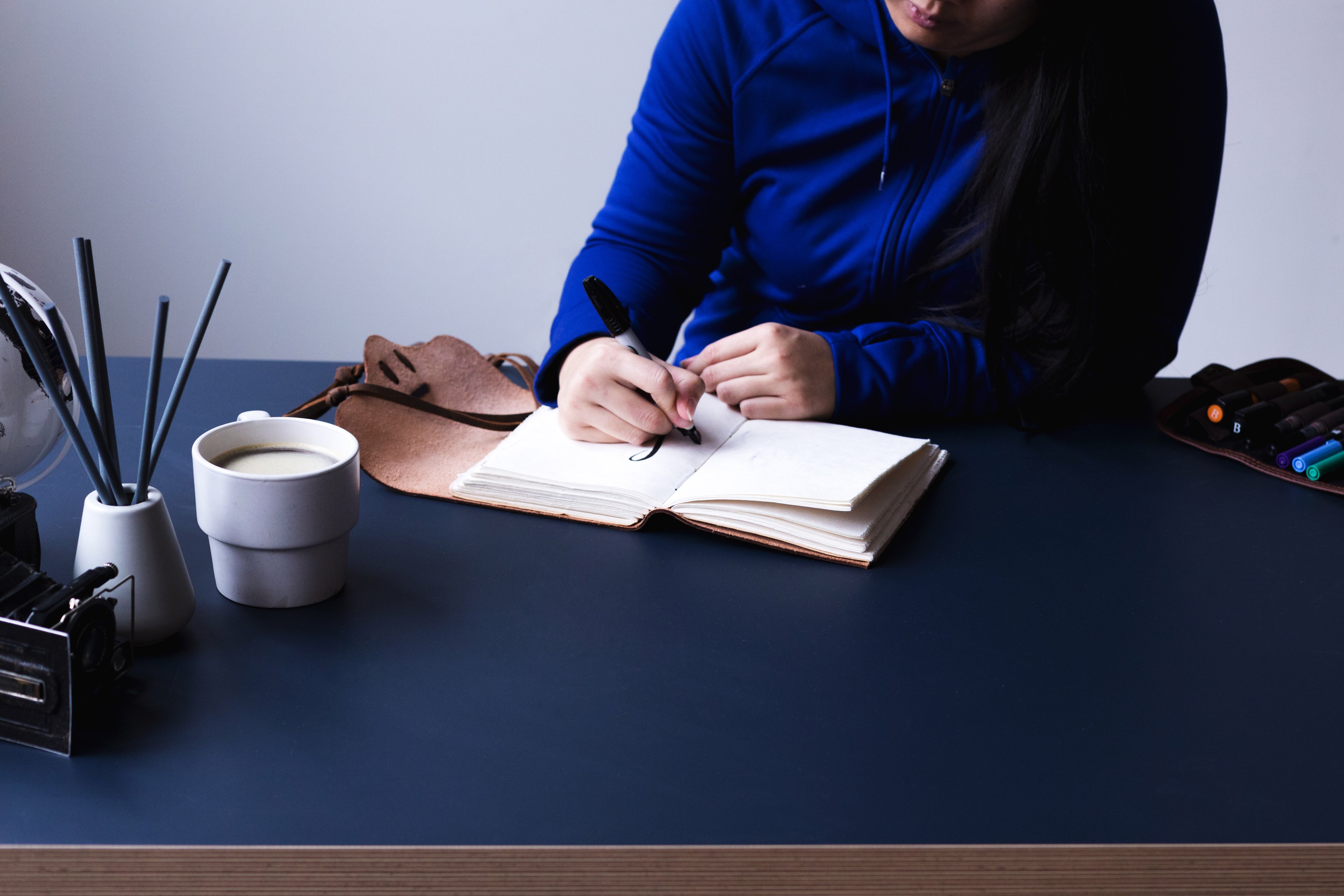 Woman writing in a notebook