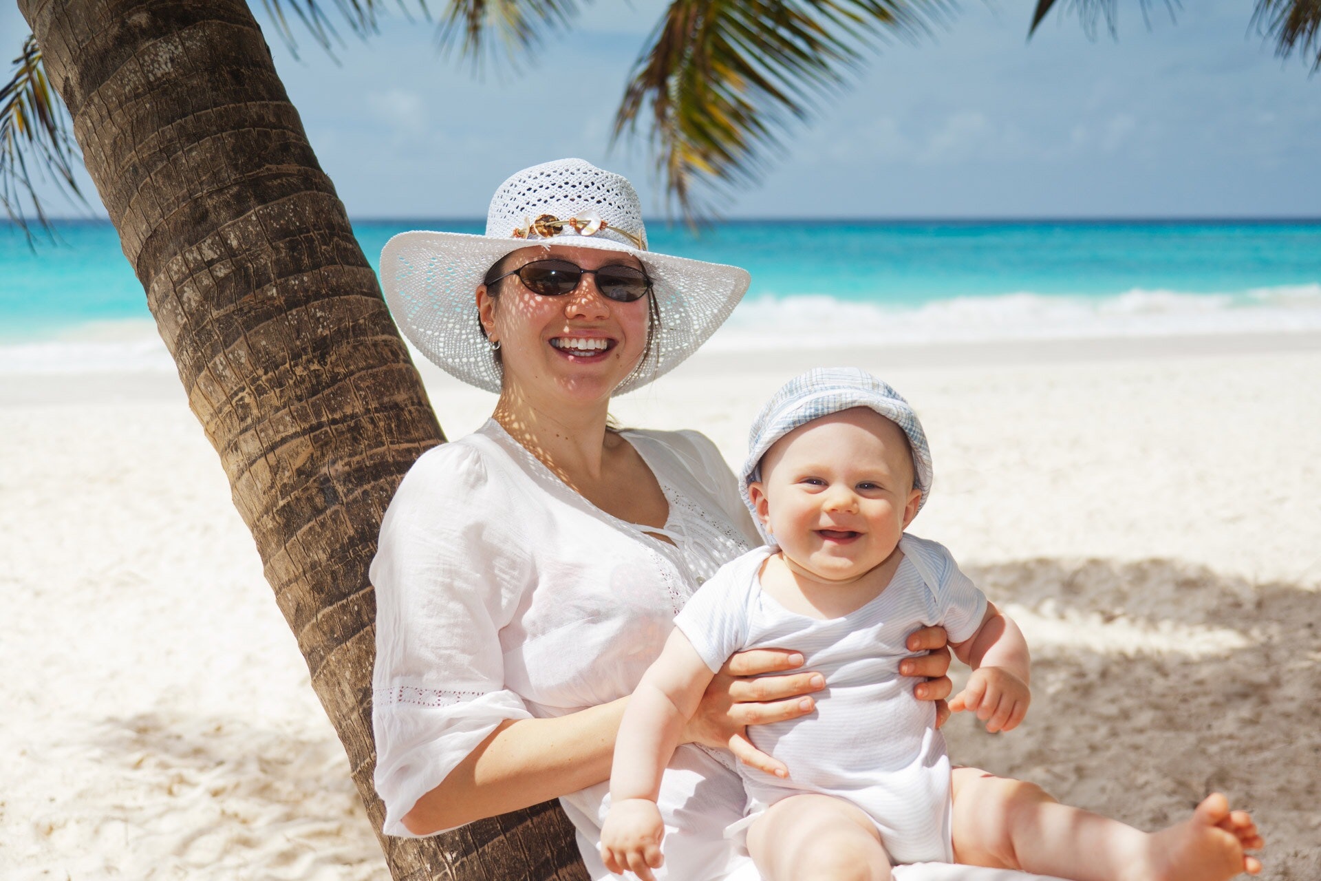 Mother and baby on beach