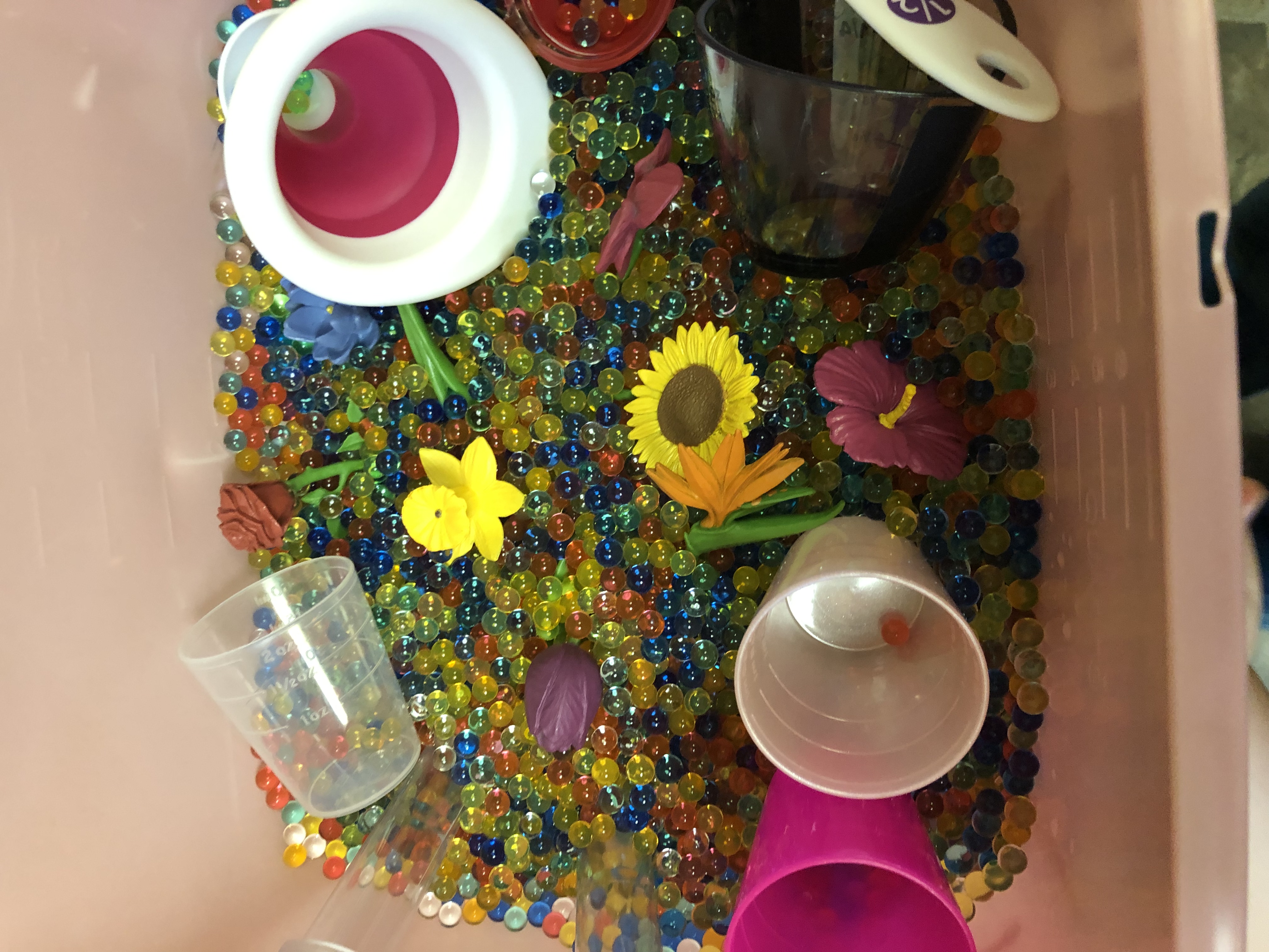 Flowers and water beads sensory bin