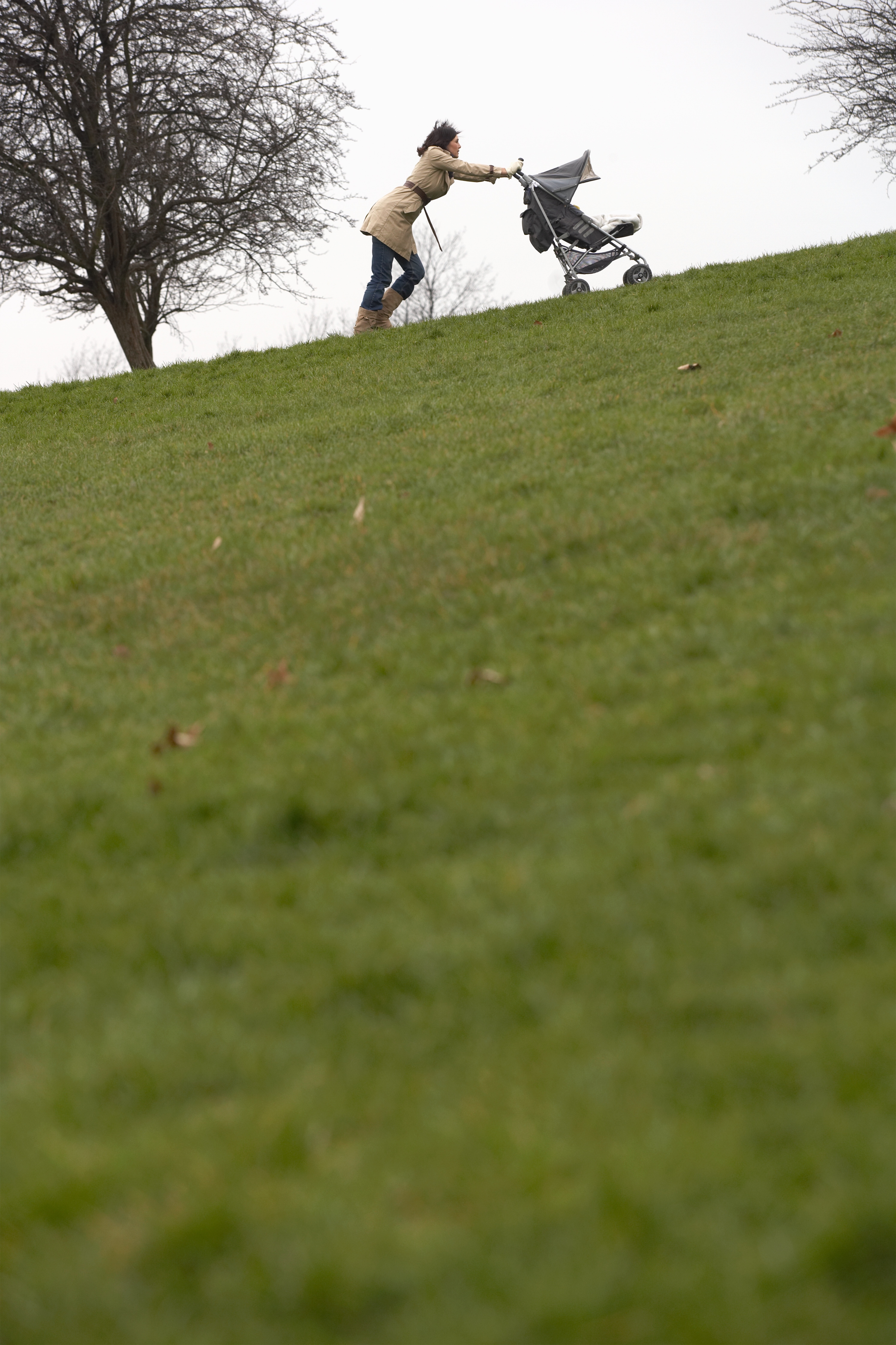 Woman walking in the park with stroller