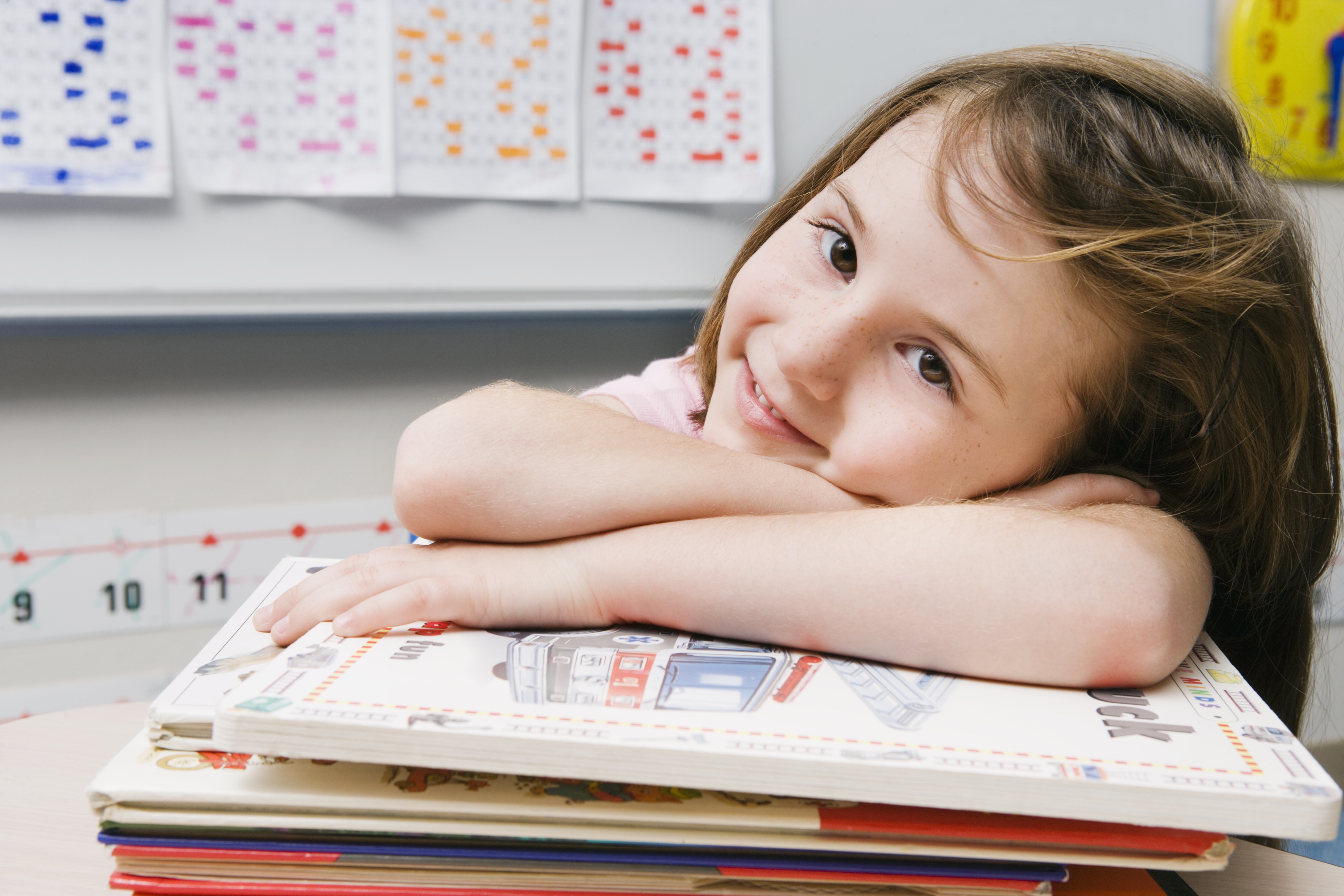 Girl with stack of books