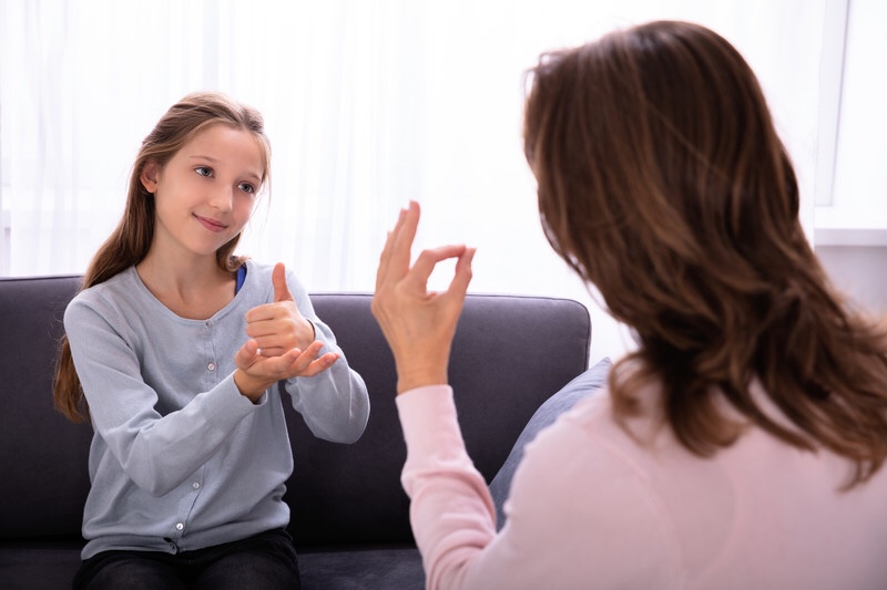 Girl learning sign language