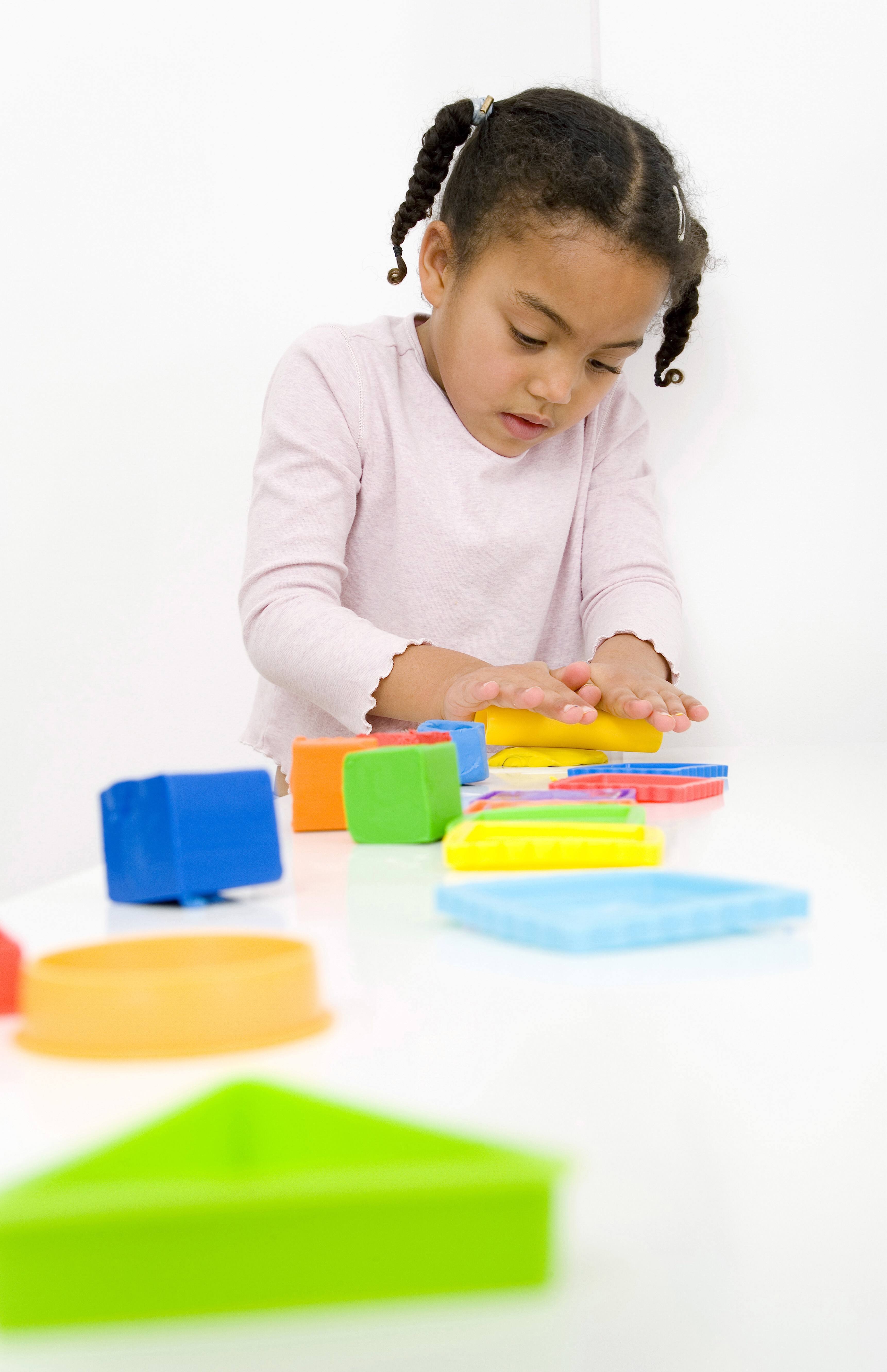 Girl playing with clay