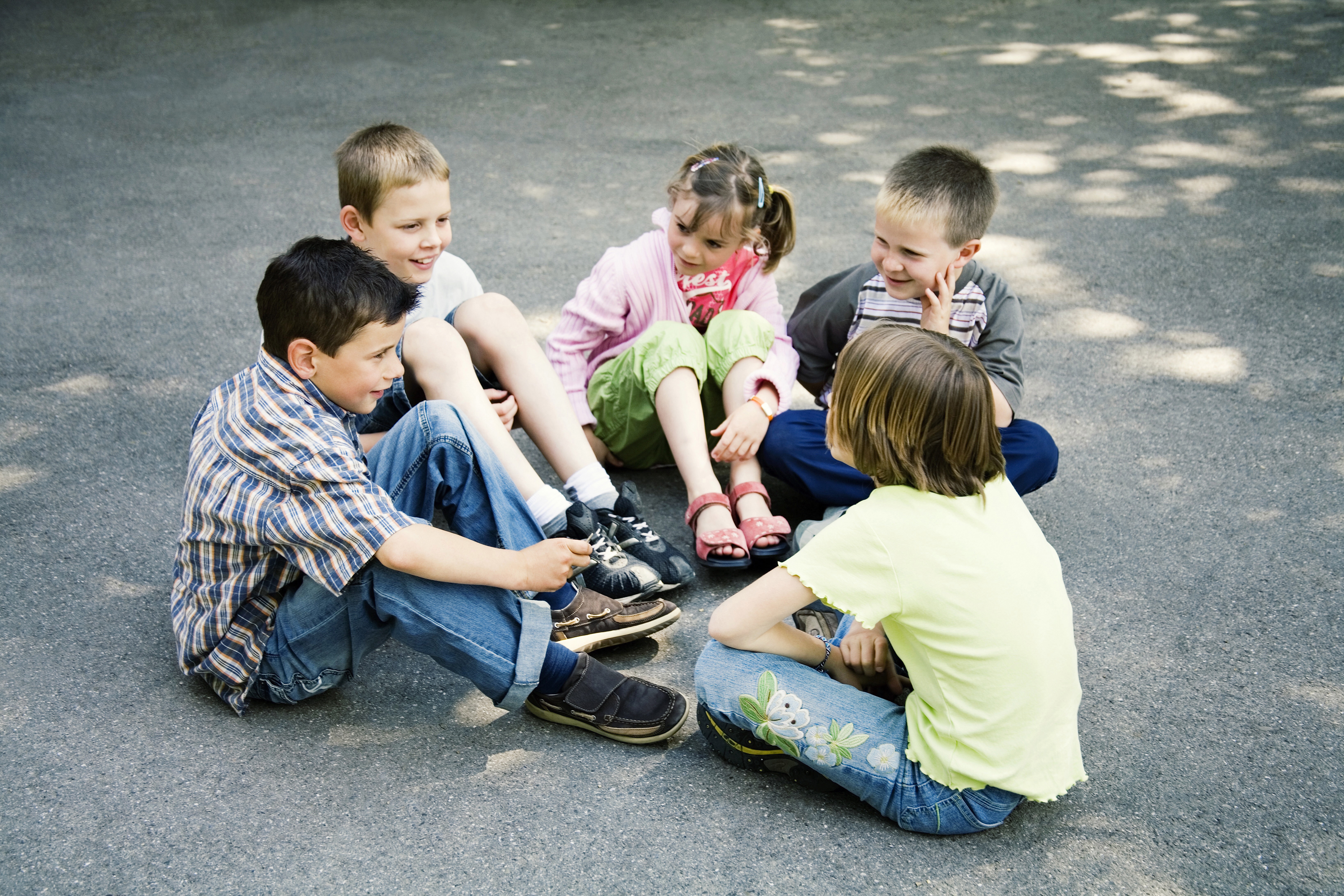Kids playing in a circle