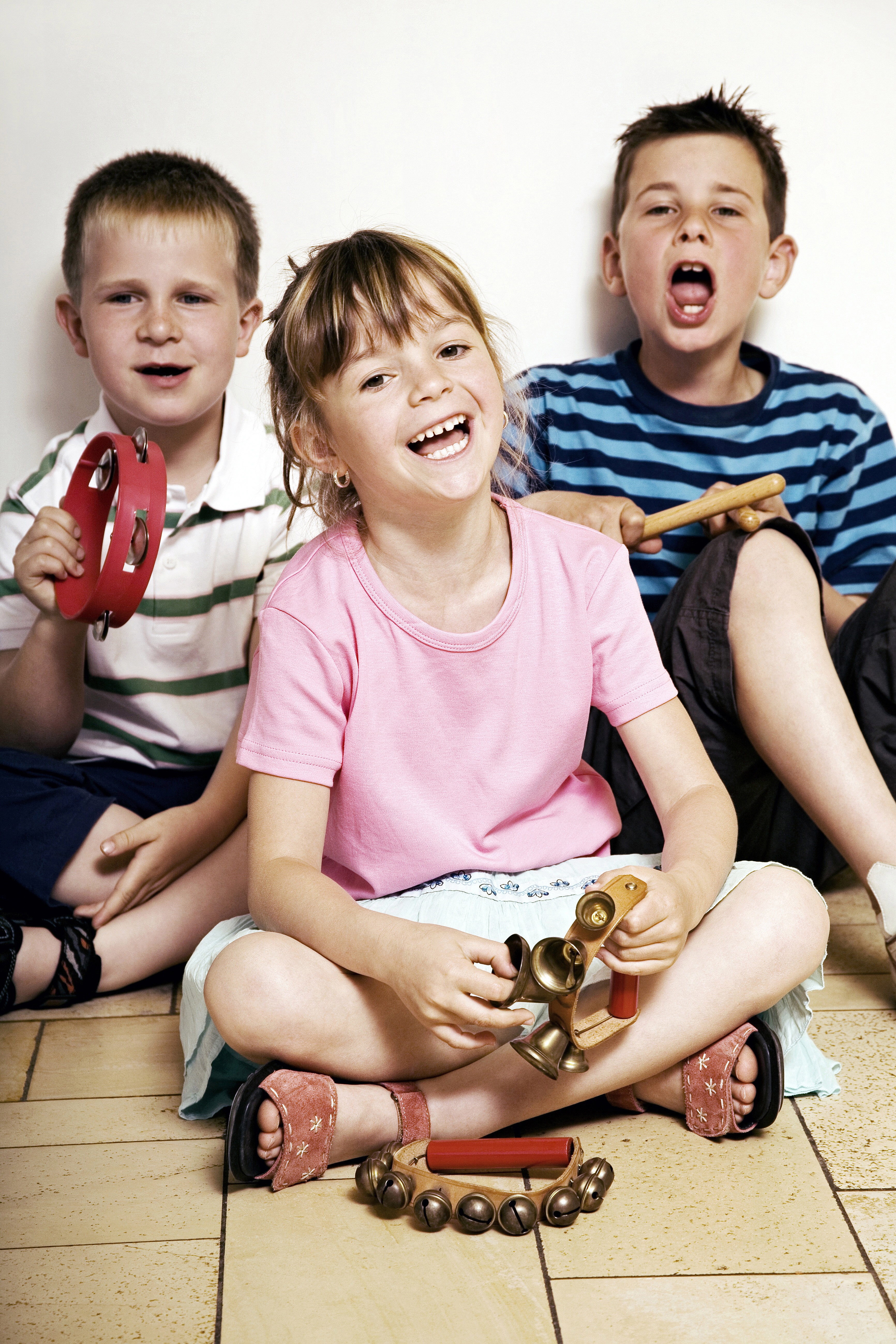 Kids singing and playing instruments