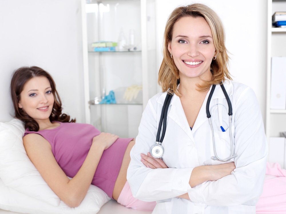 Pregnant woman with doctor