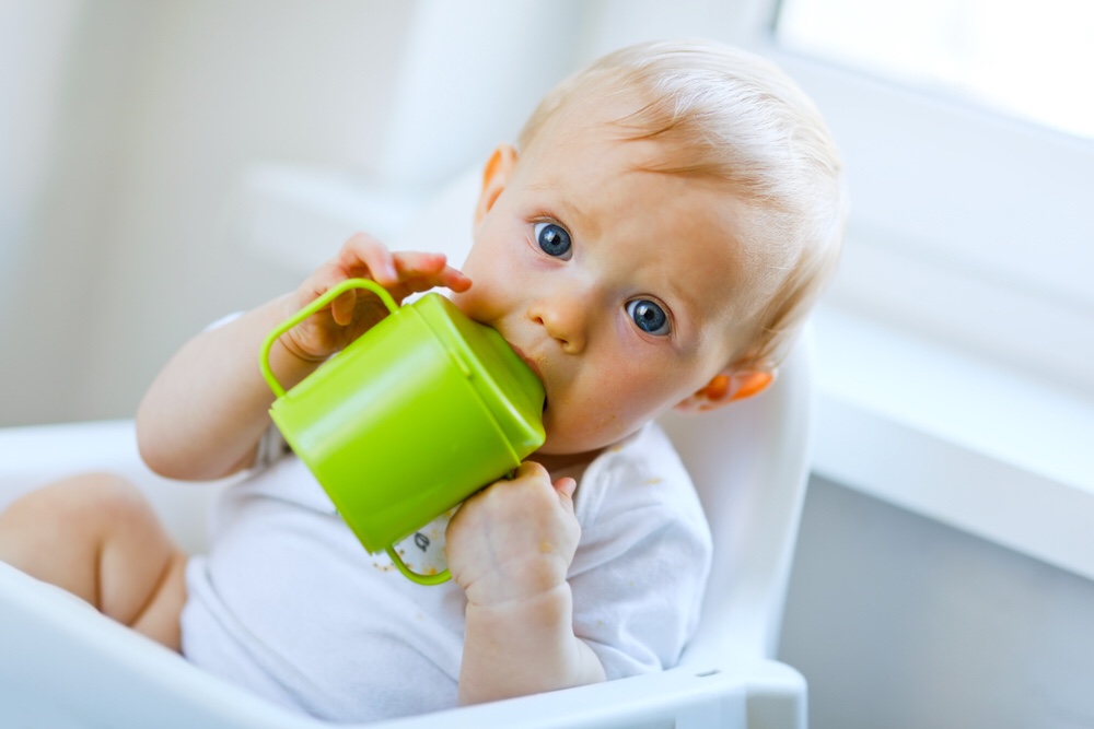 Baby drinking from cup