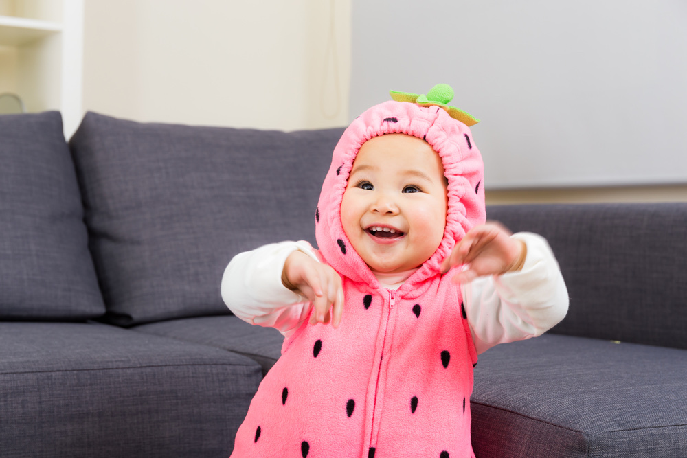 Baby in strawberry costume