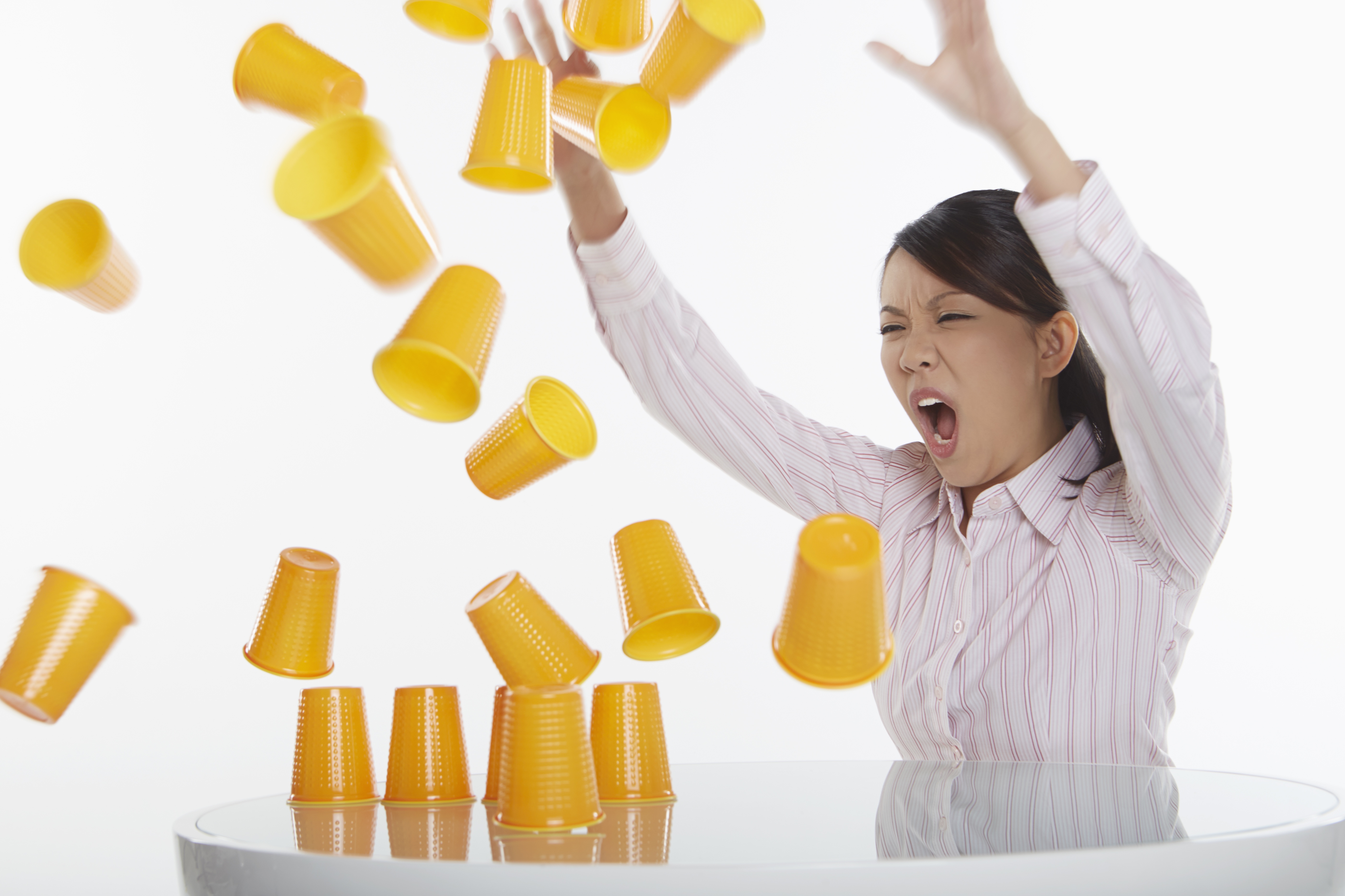 Woman hitting cups