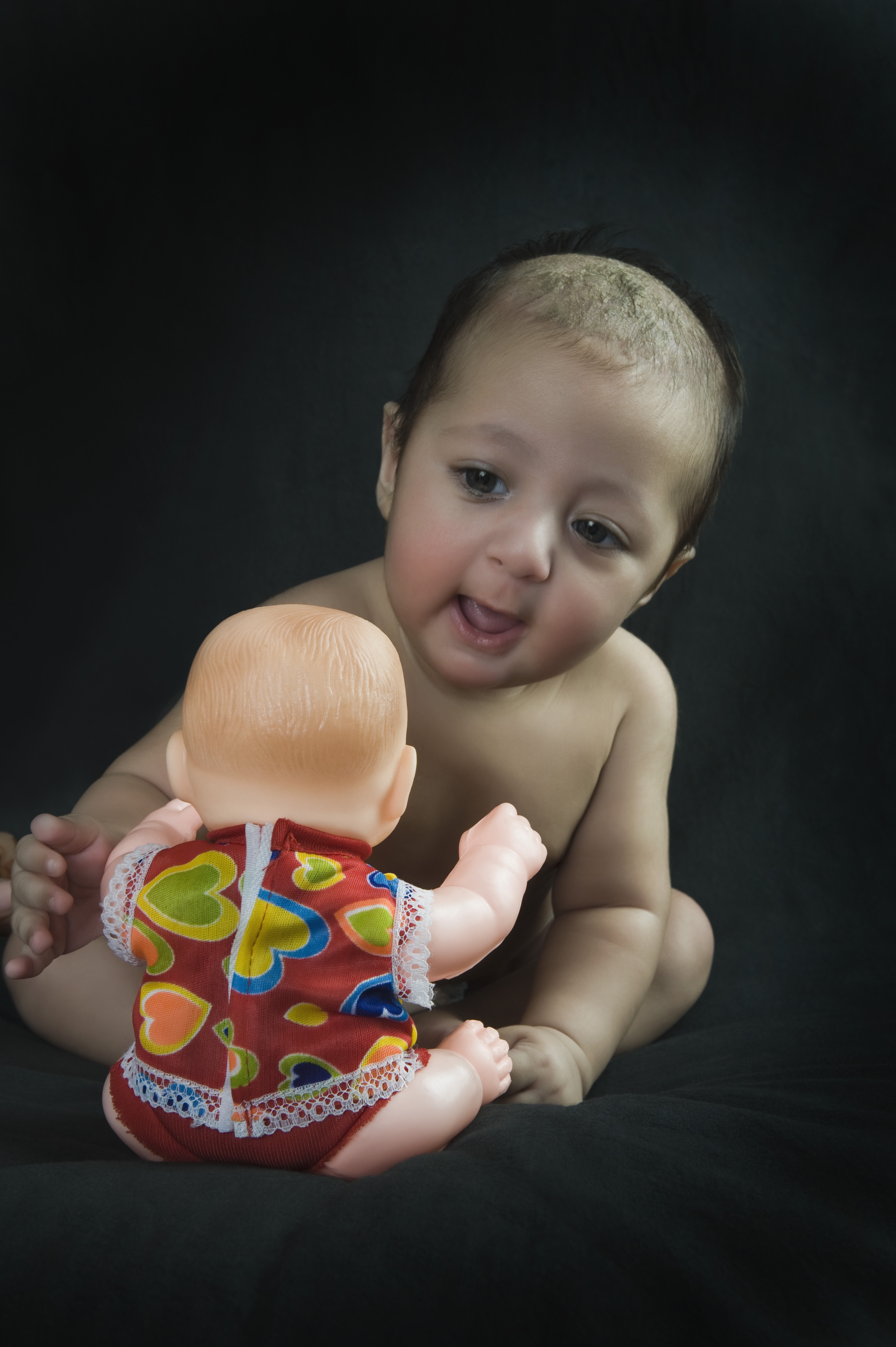 Boy playing with doll