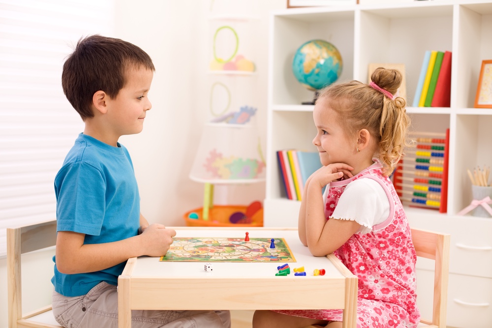 Kids playing board game