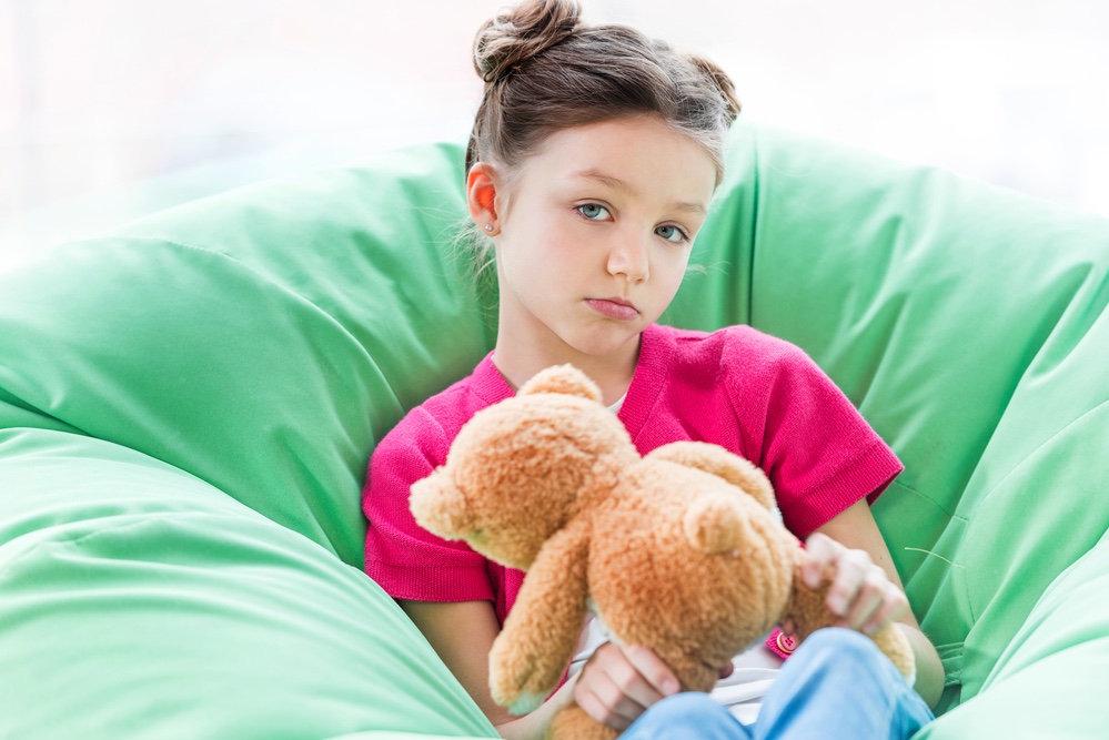 Little girl with teddy bear