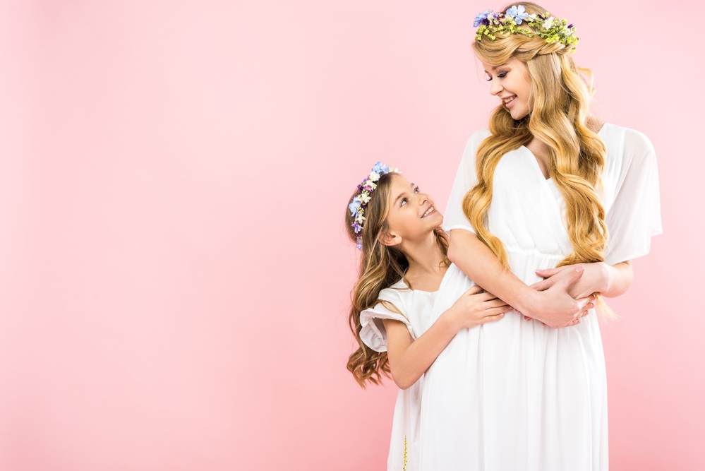 Mother and daughter in fancy dresses