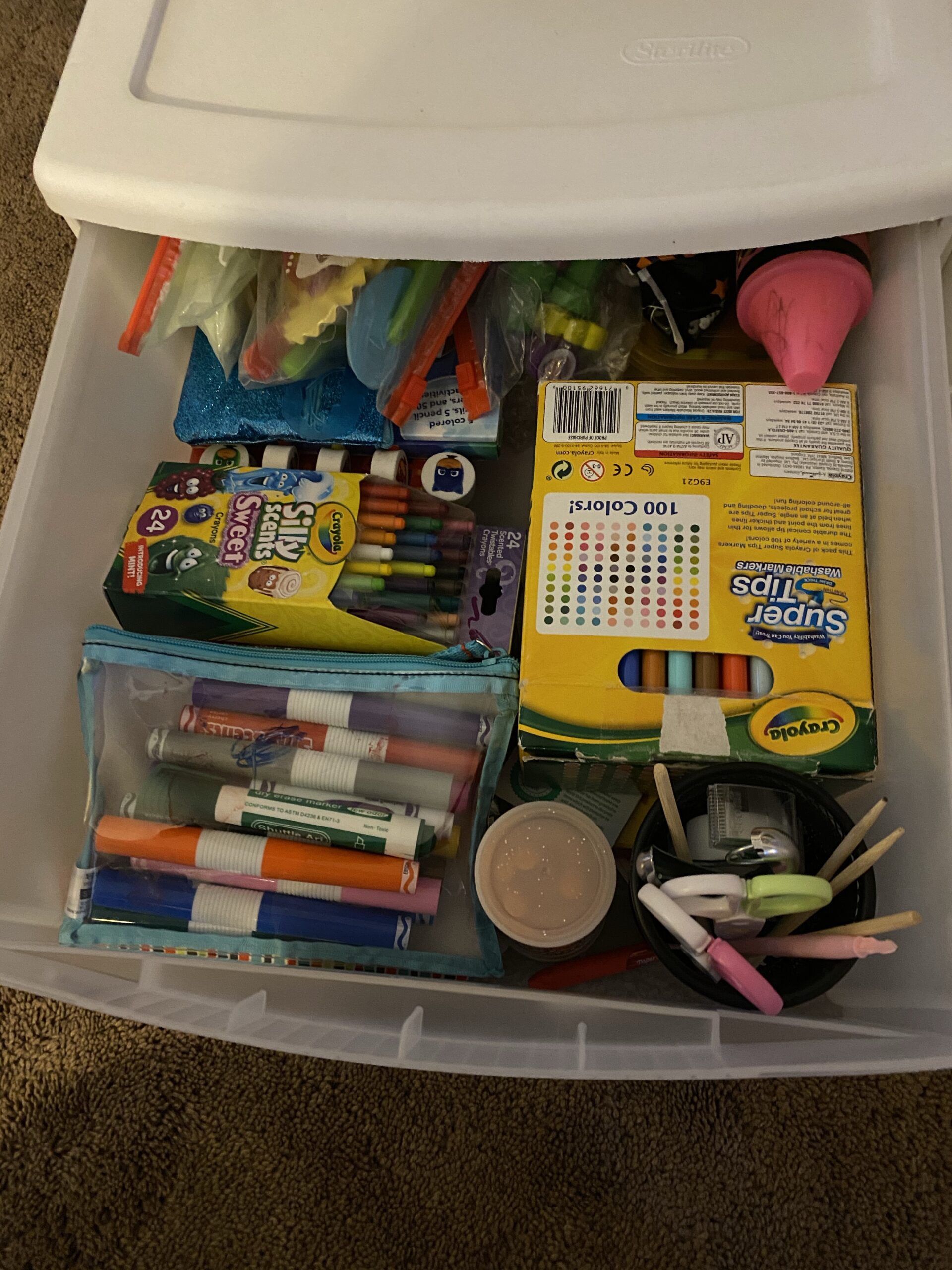 Neatly organized drawer with kids craft supplies